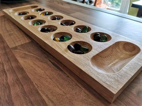 6. Always place all captured pieces in your Mancala (store). 7. The game ends when all six pockets on one side of the Mancala board are empty. 8. The player who still has pieces on his/her side of the board when the game ends captures all of those pieces. 9. 